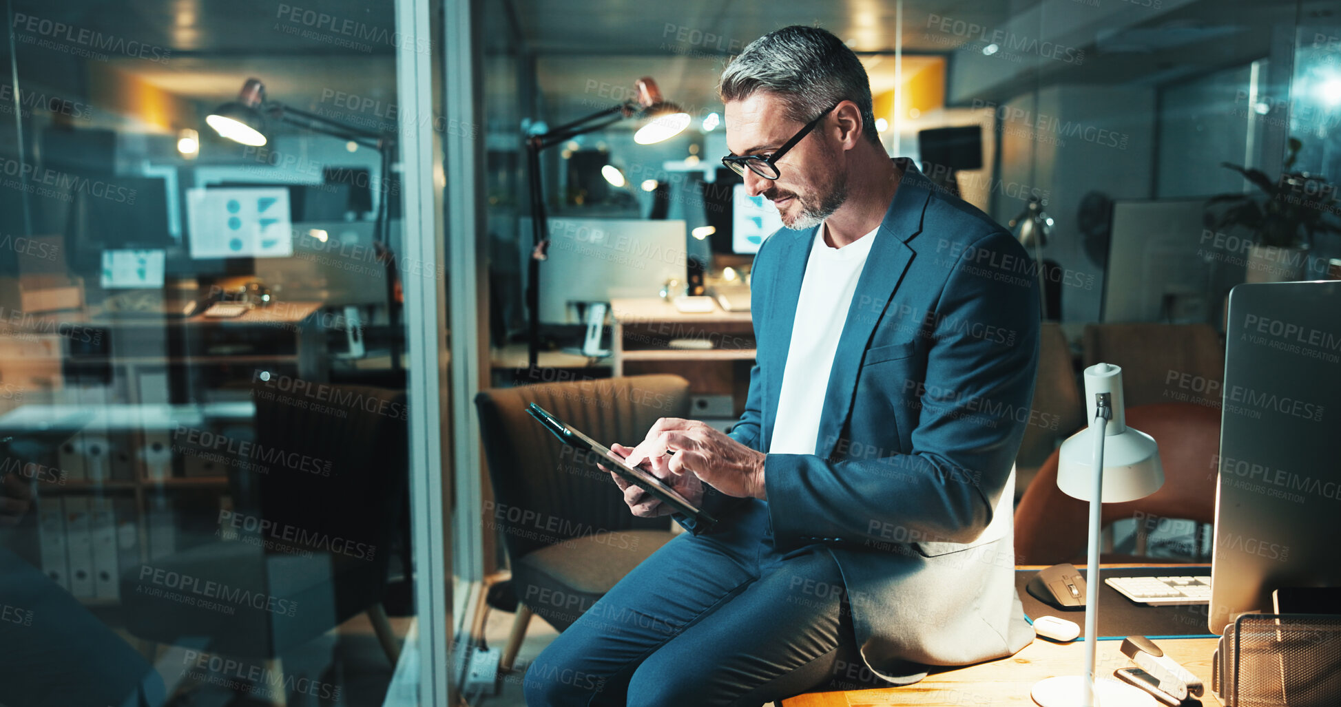 Buy stock photo Night, thinking and mature man on tablet for review, post deadline or online update research. Overtime, engagement or content strategy with tech for digital marketing trends or social media growth