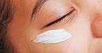 Closeup, face and cream with moisturizer for SPF, sunscreen or skincare for summer or UV protection. Creme, lotion or facial cosmetics with smudge for anti aging treatment, health or dermatology