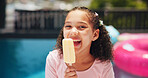 Happy girl, portrait or pool with popsicle for summer treat, holiday or vacation at luxury resort. Female person, child or kid eating with smile, dessert or ice cream for sweet or cold snack at house