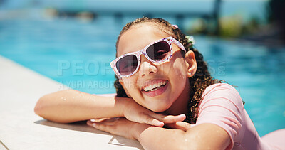 Buy stock photo Kid, sunglasses and happy girl in portrait by swimming pool for holiday, travel or outdoor vacation. Smile, summer and child sunbathing in water at lodge, hotel or resort on weekend break in Miami