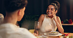 Happy, couple and red wine on date at restaurant for valentines day, romantic dinner and celebration. People, talking and alcohol with fine dining, anniversary and bonding for relationship commitment