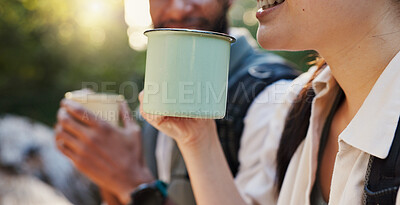 Buy stock photo Mug, coffee and hiking with interracial couple in nature for lunch break, trekking adventure and park conservation. Drinking, conversation and environment with closeup of man and woman in forest