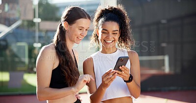 Buy stock photo Sports, online and women with phone on tennis court for social media post, internet joke or chat. Fitness club, happy and friends on smartphone after training, exercise and workout for match practice