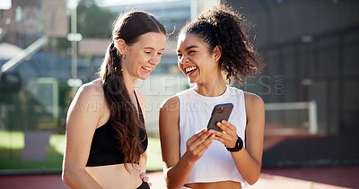 Buy stock photo Sports, happy and people with phone on tennis court for social media post, funny message and online meme. Fitness club, internet and women laugh for smartphone chat after training, practice and match