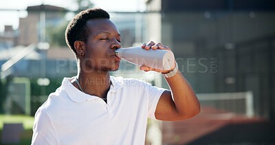 Buy stock photo Sports athlete, fitness and black man drinking water for hydration, exercise break or competition practice. Healthy, person or bottle drink outdoor for workout recovery, body detox or cardio training