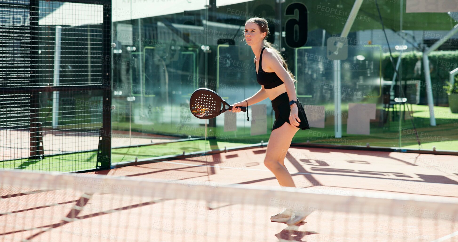 Buy stock photo Tennis sport, girl and playing on court for tournament, match exercise and waiting for ball. Ready, padel player and woman with racket for game training, performance fitness and hobby workout outdoor