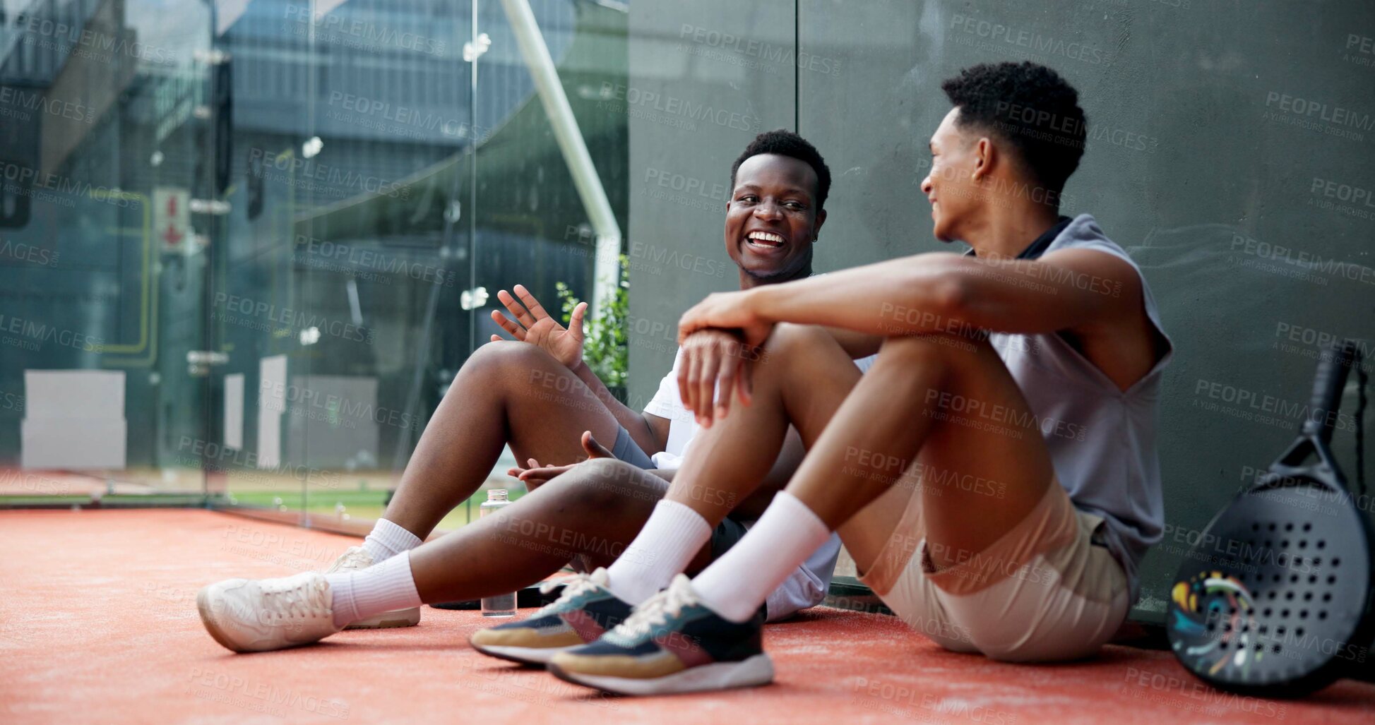 Buy stock photo Outdoor, tennis and men with break on court for resting, funny conversation or match practice. Padel, friends or laughing at fitness training for tournament support or bonding together after workout