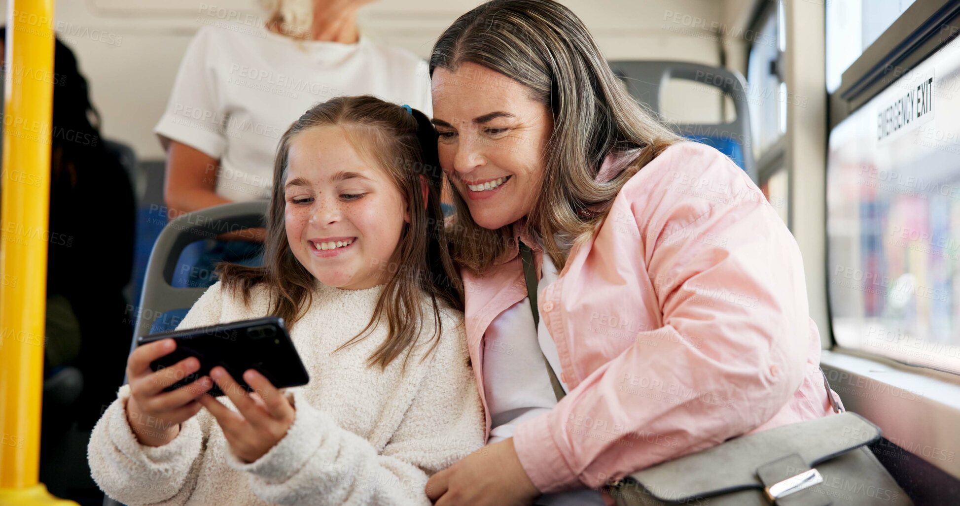 Buy stock photo Mother, child and travel on bus with phone for watching videos, online cartoon and internet streaming. Happy family, woman and trip with girl kid on transport for public service, commute or adventure