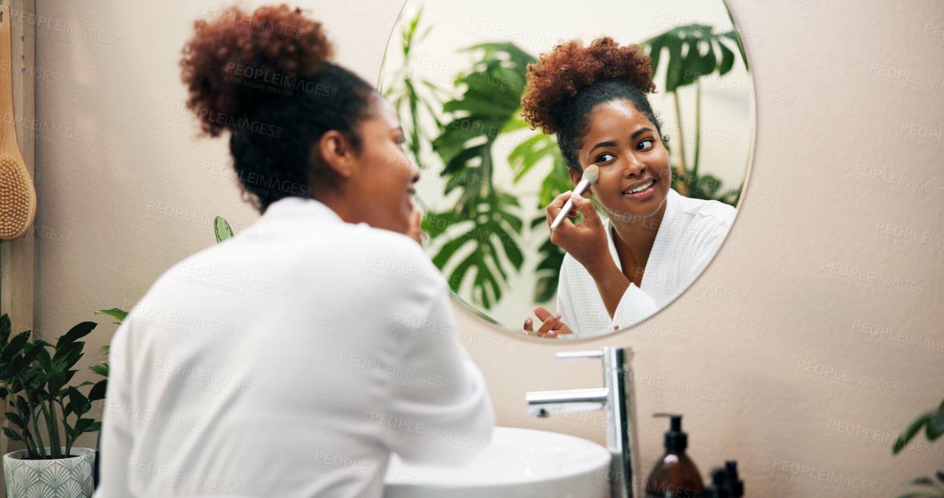 Buy stock photo Happy woman, mirror and brush with makeup for beauty, cosmetics or morning in bathroom at home. Female person, face or applying foundation with smile or reflection for cosmetology or facial at house