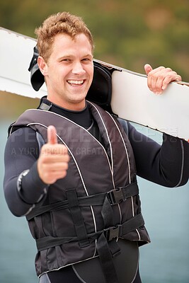 Buy stock photo Sports, thumbs up and portrait of man with wakeboard for surfing, exercise and recreation hobby by lake. Fitness, emoji hand sign and person with board for water skiing for freedom, adventure and fun