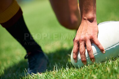 Buy stock photo Closeup shot of a man's hand on a rugby ball