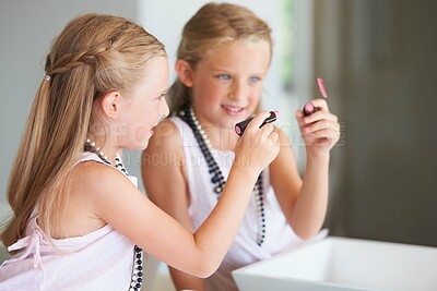 Buy stock photo Naughty little girl drawing on a mirror with her mother's lipstick