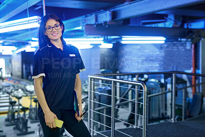 Buy stock photo Portrait, smile and woman in gym for fitness, wellness or body health with phone checklist in Italy. Professional, sports and coach at club, worker or happy personal trainer in glasses for workout