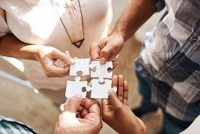 Buy stock photo Hands, group and jigsaw for strategy, solution and teamwork in collaboration for creativity at startup. People, integration and scrum for puzzle for problem solving, help and above for synergy at job