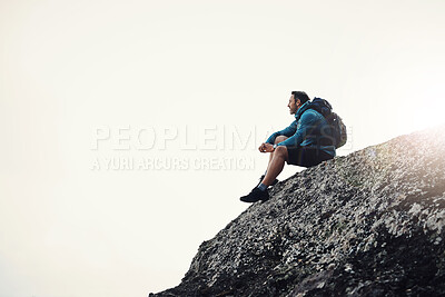 Buy stock photo Mountain, cliff and fitness man thinking in nature for hiking, break or peace, mindfulness or pause on sky background. Rock, fog and athlete with backpack for travel on hill with calm reflection