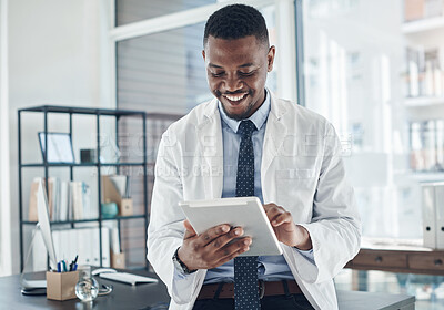 Buy stock photo Reading, doctor and black man with tablet, office and telehealth in clinic, web and online for healthcare. Workplace, hospital and internet for technology, medical and science for research of staff