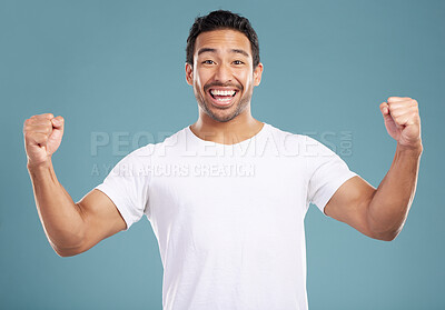 Buy stock photo Studio, man and excited in portrait with fist pump, celebration and achievement for winning prize. Hand gesture, male person and winner with cheering for bonus, discount and yes by blue background