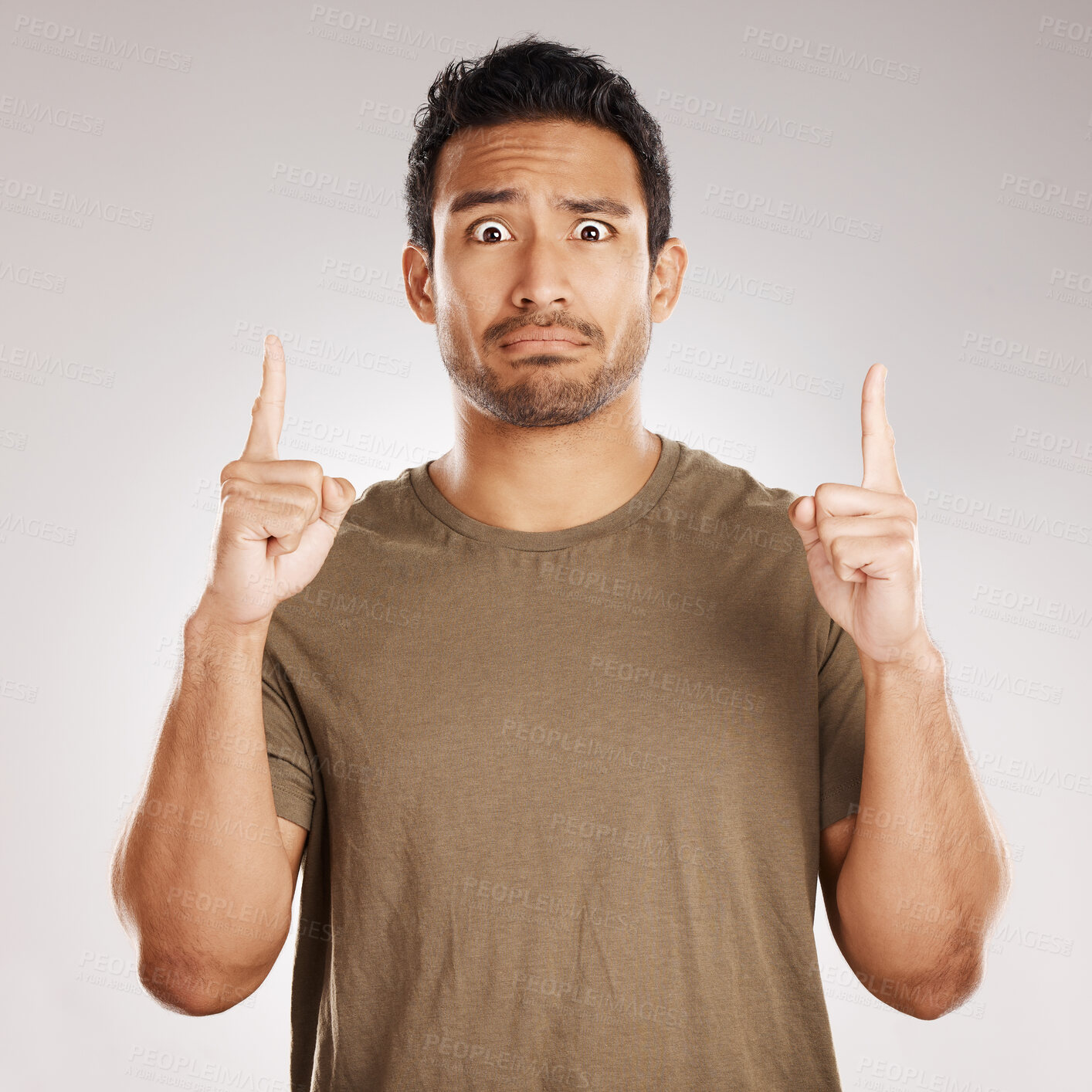 Buy stock photo Portrait, surprise and man in studio, pointing up and announcement on gray background. Face, person and model with hand gesture, expression and confused with shock, wow and deal with information