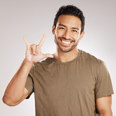 Buy stock photo Portrait, sign language and smile of man on studio background for communication or hand gesture. Happy, love and voice with palm of deaf person showing affection, romantic or social media emoji