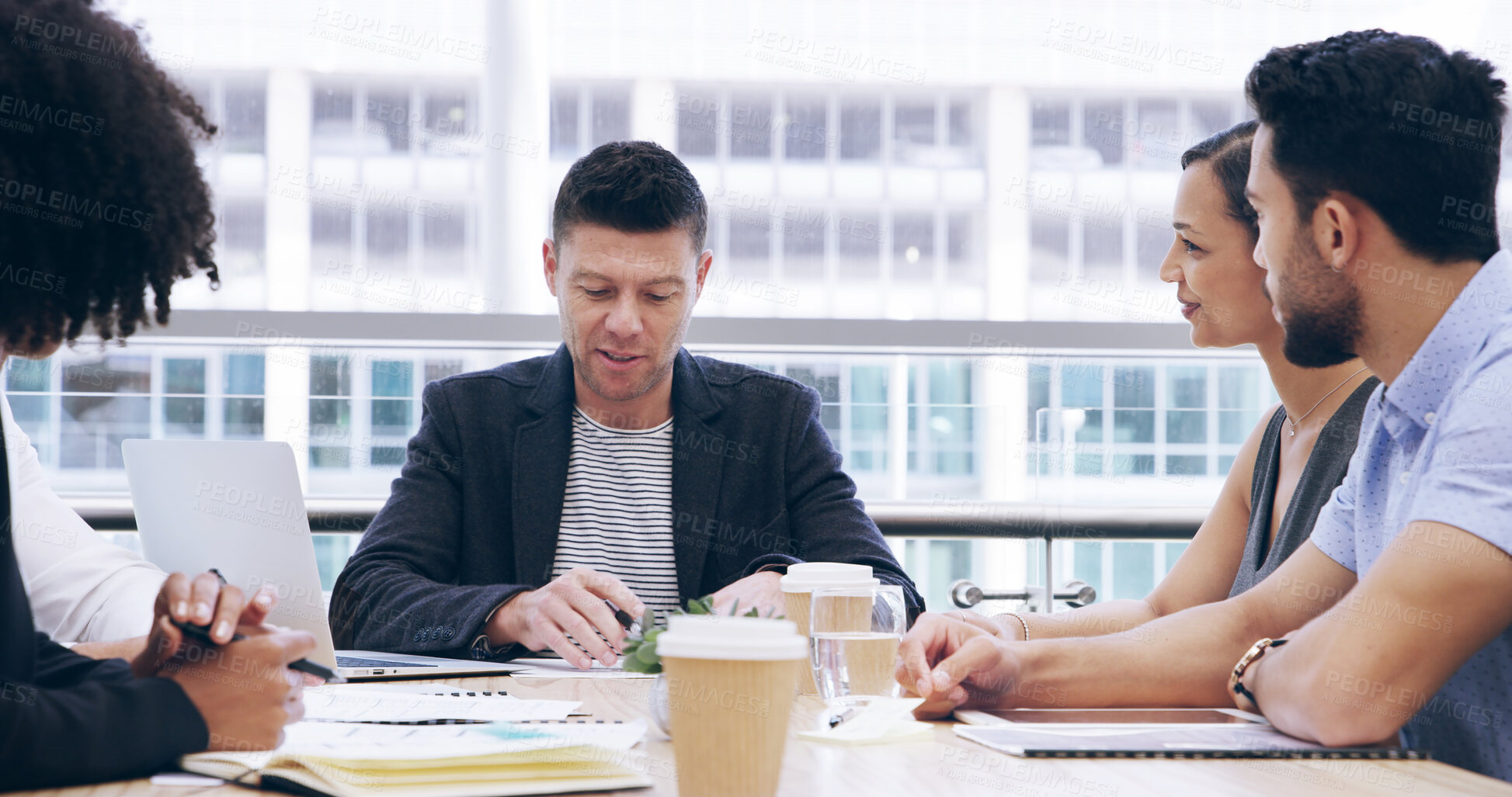 Buy stock photo Businessman, laptop and people with meeting, feedback and manager for office and documents. Paper discussion, teamwork and talk with portfolio, growth strategy or project report for finance training