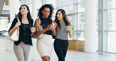 Buy stock photo Businesswomen, coffee and team walking with phone in office for conversation. Happy workers, collaboration and friends with mobile for networking on social media online in creative startup on break