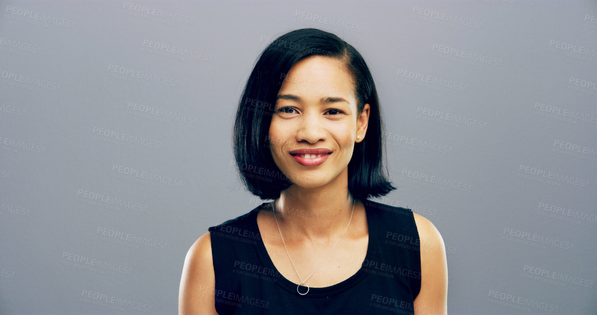 Buy stock photo Portrait, creative and woman with smile in studio for ambition, about us and public relations. Female person, confident and internship agency for reporting news, story publication and gray background