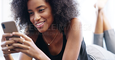 Buy stock photo Smile, woman and relax with phone for message, digital comment and chat with online contact. Happy, African female person and reading with mobile for news app, blog website and text on social media