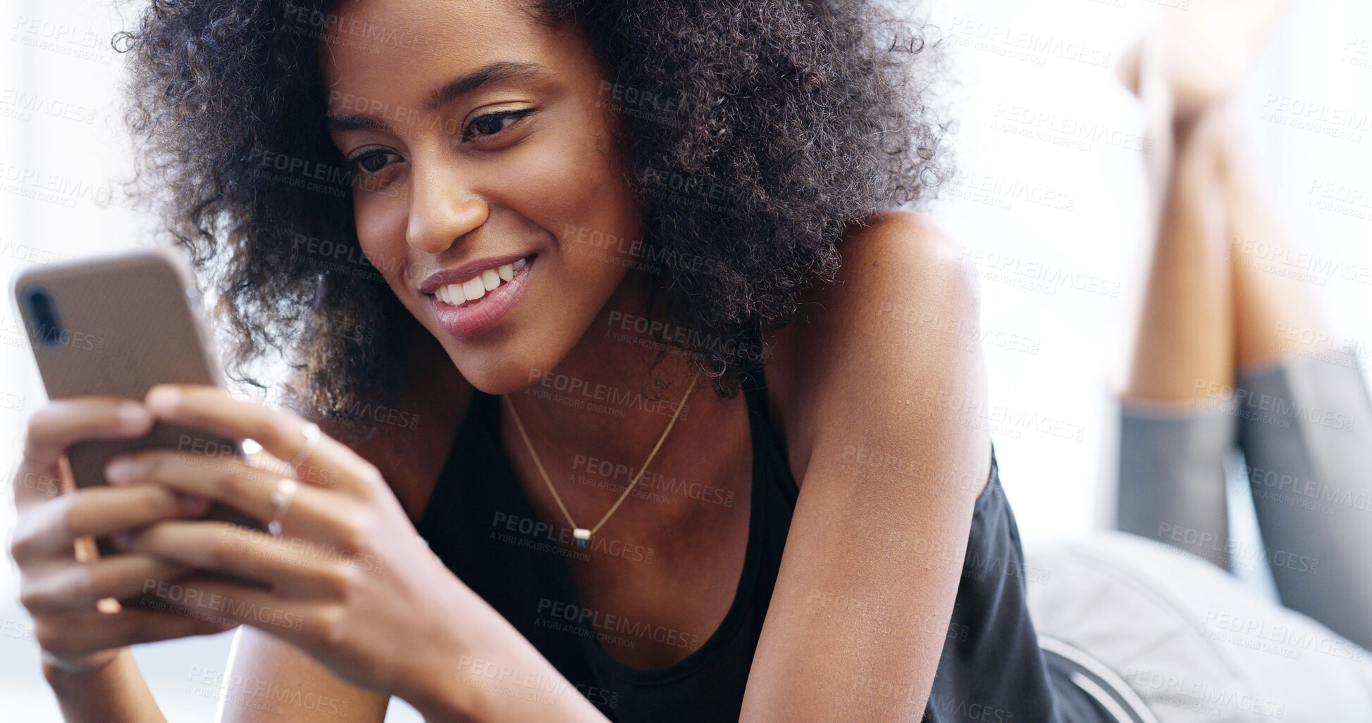 Buy stock photo Smile, woman and relax with phone for message, digital comment and chat with online contact. Happy, African female person and reading with mobile for news app, blog website and text on social media
