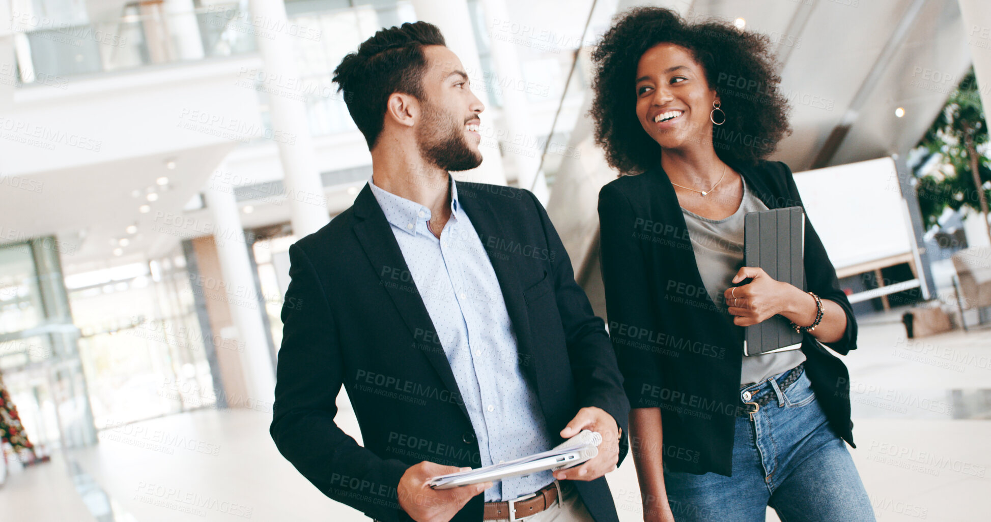 Buy stock photo Business people, smile and talking in lobby for confidence, professional and career in news agency. Journalist, editor and folder in office for company publisher, consultant or walking for occupation