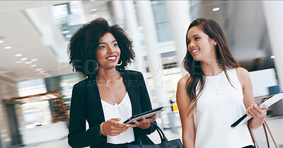 Buy stock photo Business women, smile and walk in lobby for confidence, professional and career in news agency. Journalist, editor and tablet in office for company development, consultant or pride for occupation