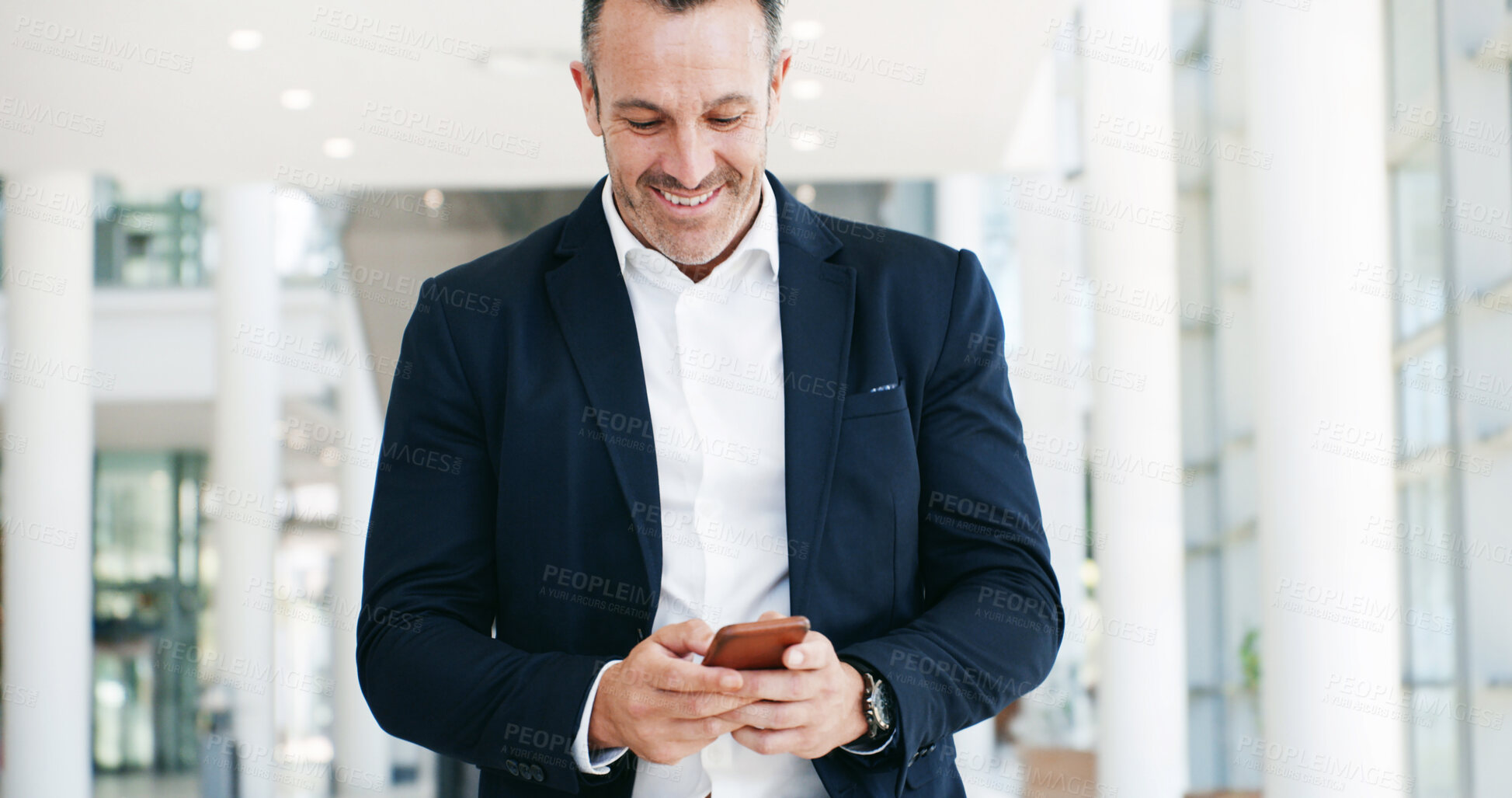 Buy stock photo Walking, phone and business man in office for email, networking and communication in lobby. Professional, corporate and worker on smartphone for internet, research and online planning on mobile app