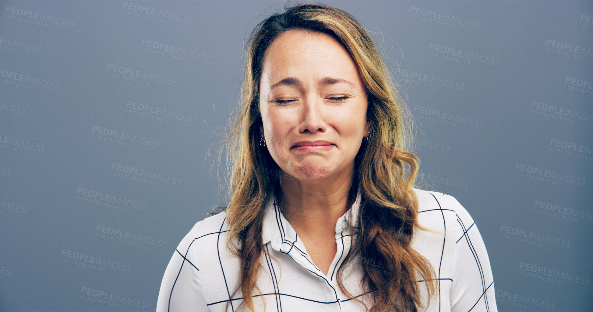 Buy stock photo Depression, crying and sad with woman for mental health crisis, disaster and broken heart. Unhappy face, anxiety and person with bad news, stress and abuse victim on gray studio background space