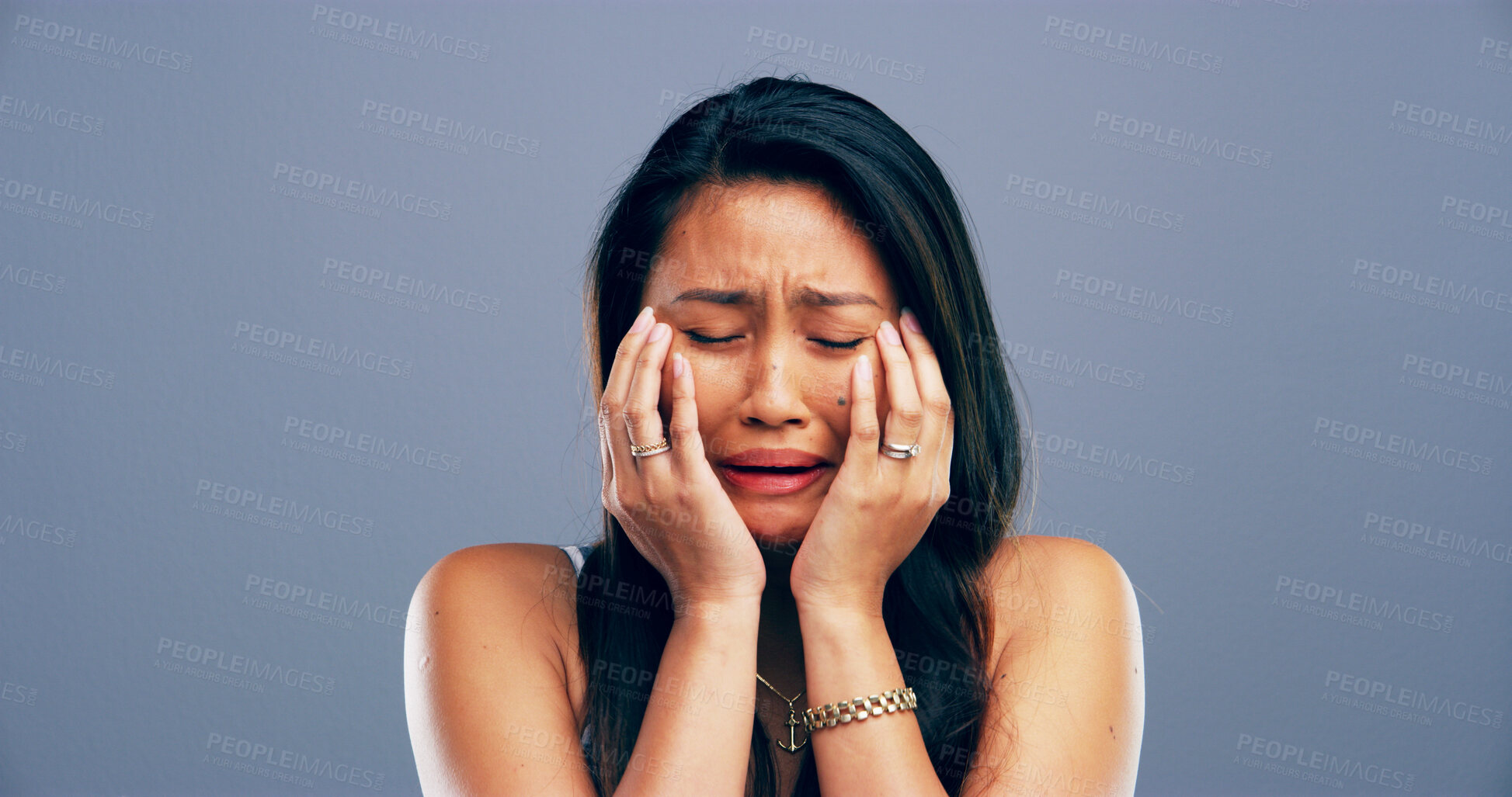 Buy stock photo Unhappy, woman and sad with crying in studio for mental health, pain and grief with mockup space. Emotional, bad news and person with depression on gray background for mourning, sorrow and trauma