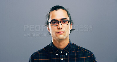 Buy stock photo Glasses, mockup and portrait with man in studio for intelligence, optometry or vision. Confident, eyewear and space with serious person at optometrist for eye health appointment on gray background