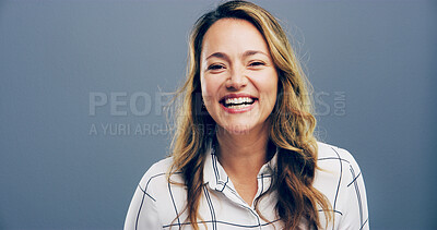 Buy stock photo Woman, portrait and laughing in studio for joke, funny memory and comedy with mockup space. Confident model, female person and happiness with humor by blue background, satisfaction and emoji reaction
