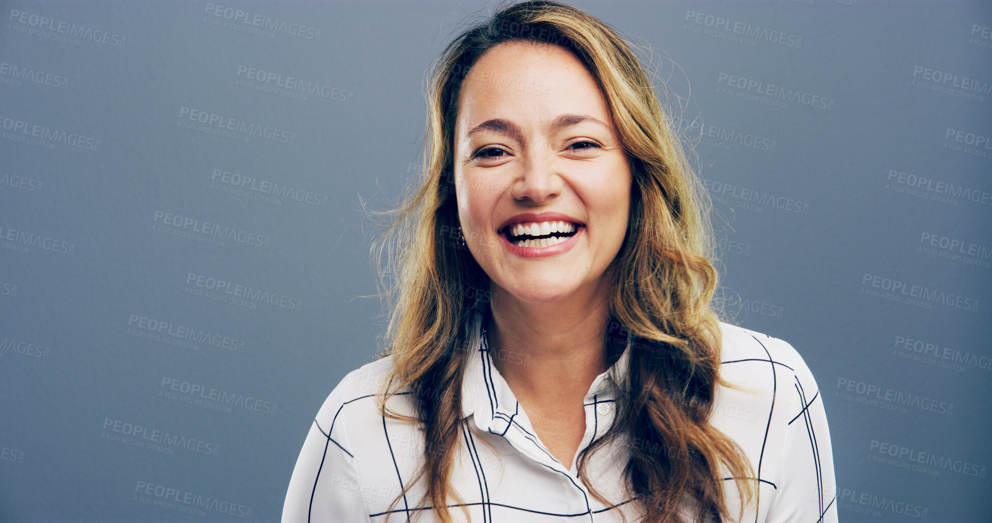 Buy stock photo Woman, portrait and laughing in studio for joke, funny memory and comedy with mockup space. Confident model, female person and happiness with humor by blue background, satisfaction and emoji reaction