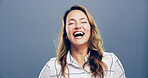 Studio, woman and freedom with laughing for joke, funny and confident with comedy by mockup space. Model, female person and happiness with humor by blue background, satisfaction and emoji reaction
