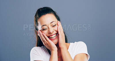 Buy stock photo Laughing, smile and face of woman in studio for comic, funny and silly with mockup space. Happiness, meme and comedy with female person on blue background for joke, humor and giggle reaction