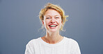 Portrait, woman and comedy with laughing in studio, funny memory and joke with mockup space. Confident model, female person and happiness with humor by blue background, satisfaction or emoji reaction