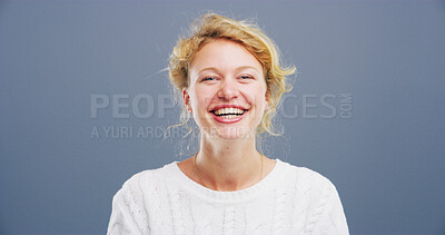 Buy stock photo Portrait, woman and comedy with laughing in studio, funny memory and joke with mockup space. Confident model, female person and happiness with humor by blue background, satisfaction or emoji reaction