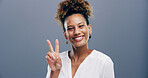 Girl, peace sign and smile in studio, excited and icon with v symbol for victory by background. Woman, afro and happy with emoji, fashion and pride for portrait with hand gesture in Costa Rica