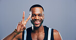 Black man, peace sign and happy in studio portrait, icon and v symbol for victory by background. Model, person and style with pride, smile and emoji with fashion, vote and hand gesture in Nigeria