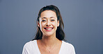Happy woman, portrait and joy with positivity in studio for creative career or design on a gray background. Face, female person or model with smile for cheerful or friendly expression on mockup space