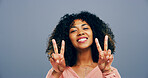 Girl, peace sign and space in studio, smile and icon with v symbol for victory by background. Woman, afro and happy with emoji, fashion and excited for portrait with hand gesture in Costa Rica