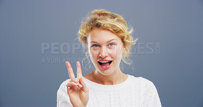 Buy stock photo Portrait, smile and woman with peace sign, studio and happy for scholarship in college and excited. Blue background, mockup space and person with gesture for opportunity, student or university in USA