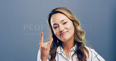 Buy stock photo Rocker, hand and funky with portrait of woman in studio for metal music, punk identity and crazy. Devil horn sign, edgy and attitude with person on background space for energy, emoji and expression