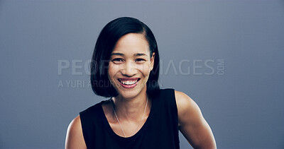 Buy stock photo Portrait, happy and Asian woman in studio for ambition, creative career and about us as designer. Smile, female person and laughing for funny joke, confident and friendly attitude on gray background