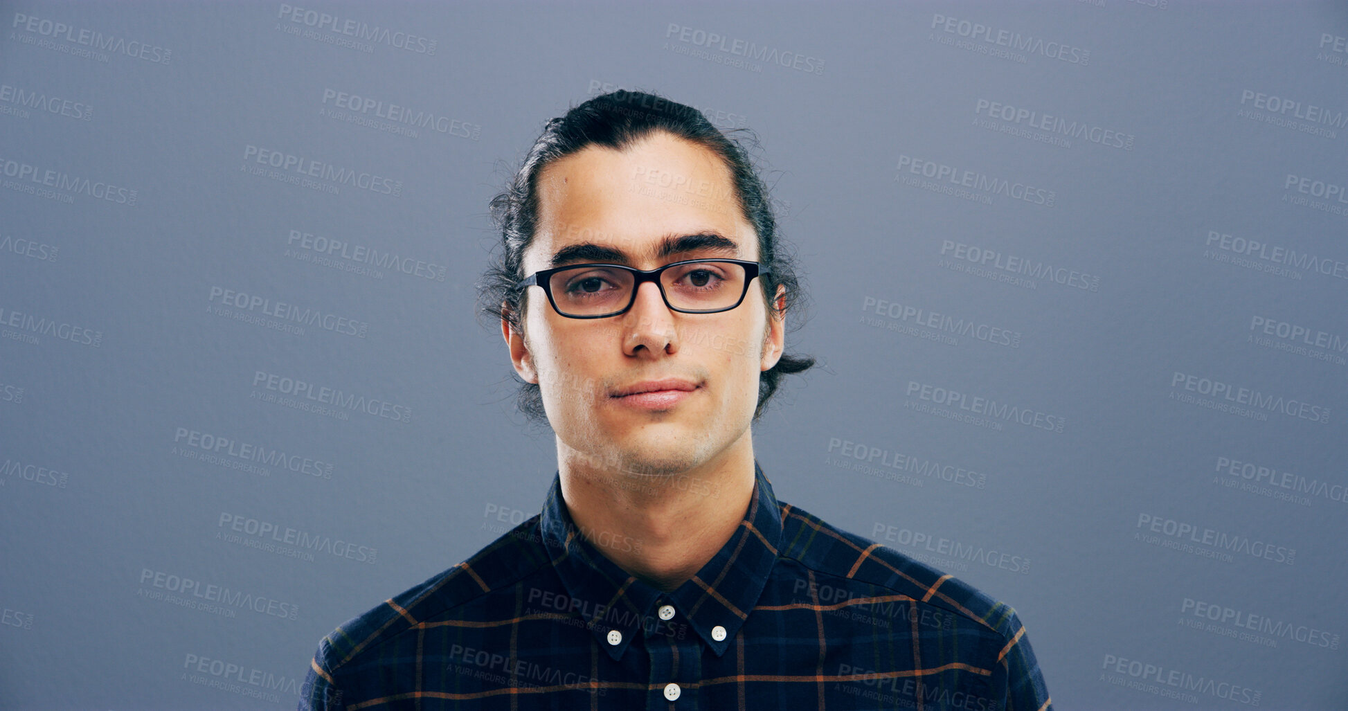 Buy stock photo Glasses, portrait and space with man in studio for intelligence, optometry or vision. Confident, eyewear and mockup with serious model isolated on gray background for prescription frame or lens