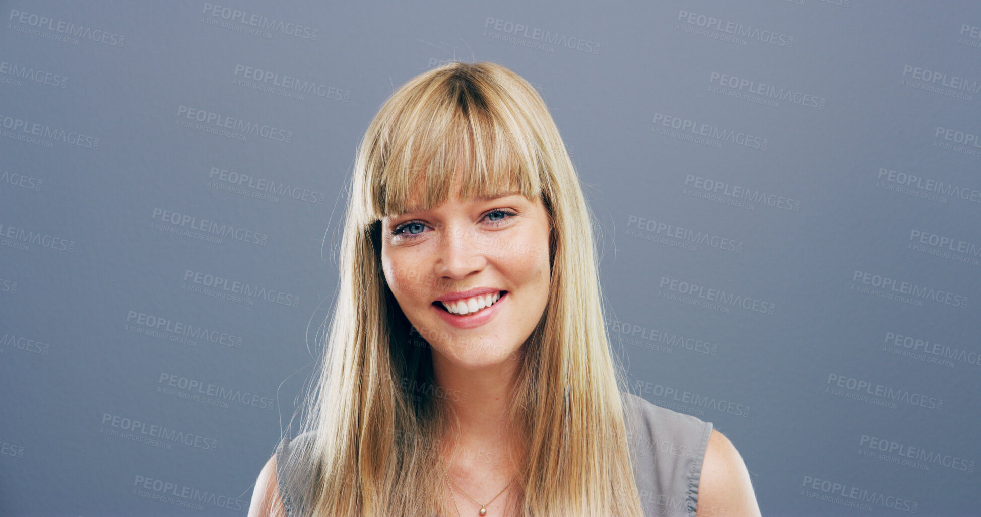 Buy stock photo Happy, woman and portrait of teacher in studio with pride for tutor career for education. Smile, gen z and female educator at elementary school from Germany with knowledge by gray background.