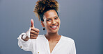 Thumbs up, yes and portrait of woman in studio for approval, success and feedback. Like emoji, sign and agreement with african person and smile on background for vote, symbol and promotion icon 